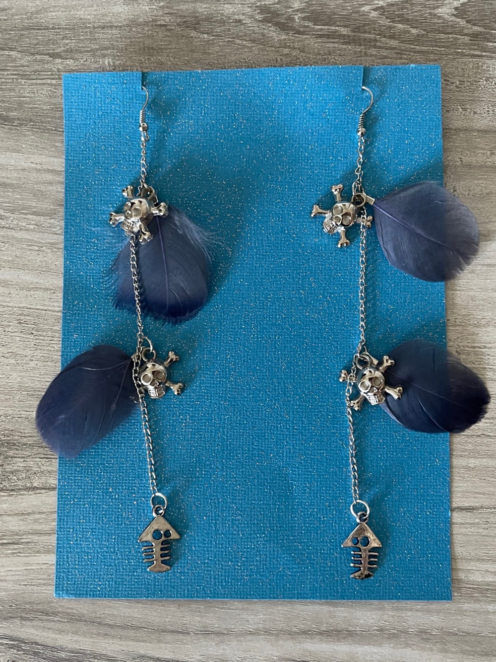 Dark blue feather silver skull earrings 5.5”